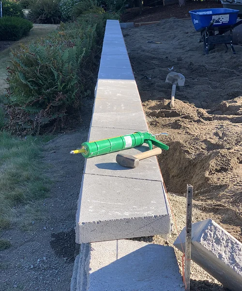 Retaining wall and new grass installation in Federal Way 